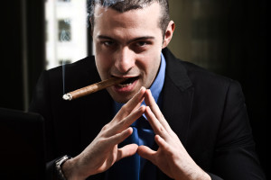 Shady man smoking a cigar